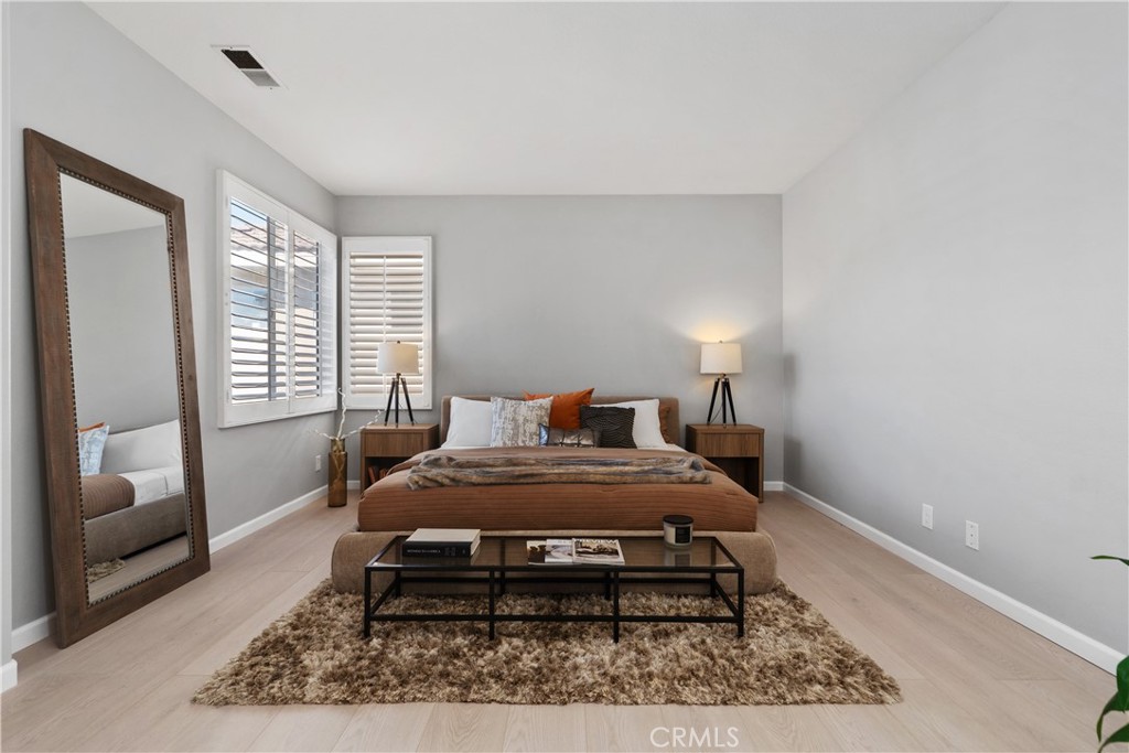 17 Nopalitos Way Aliso Viejo, CA 92656 - Photo 16 of 37 a bedroom with a bed and wooden floor