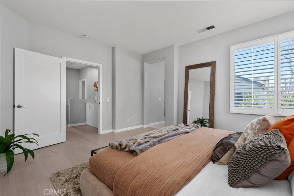 17 Nopalitos Way Aliso Viejo, CA 92656 - Photo 17 of 37 a bedroom with a bed and a potted plant