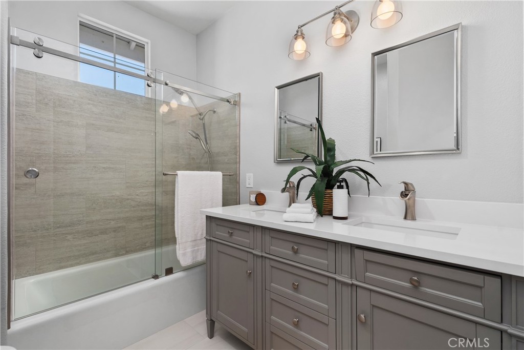 17 Nopalitos Way Aliso Viejo, CA 92656 - Photo 21 of 37 a bathroom with a sink and a mirror with bathtub