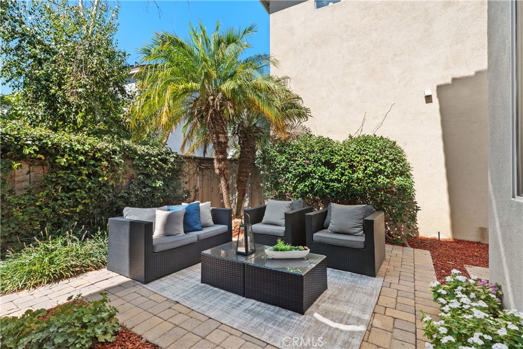 17 Nopalitos Way Aliso Viejo, CA 92656 - Photo 25 of 37 a patio with patio a couch and potted plants