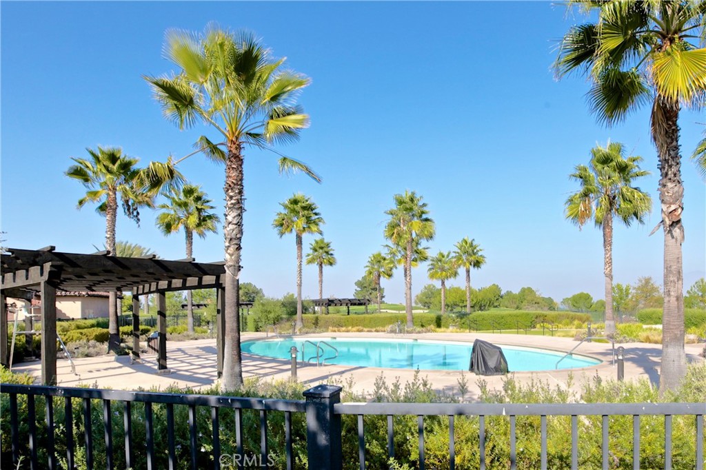 17 Nopalitos Way Aliso Viejo, CA 92656 - Photo 37 of 37 a view of a swimming pool with a table and chairs