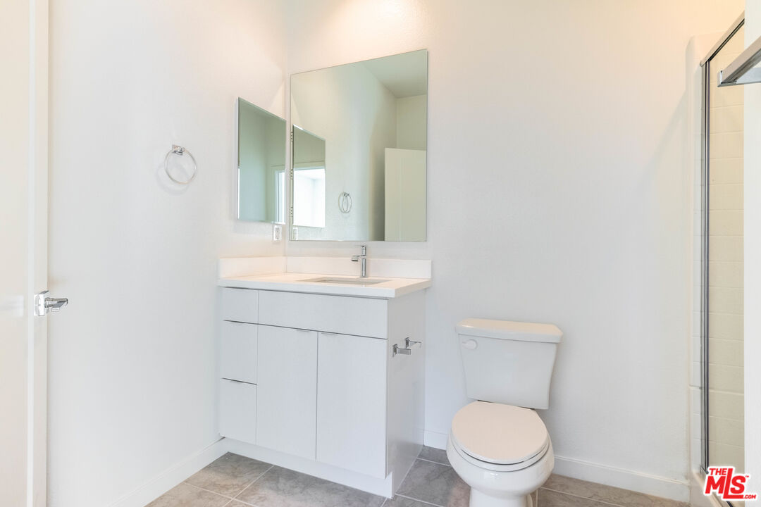434 Hudson Street Brea, CA 92821 - Photo 12 of 44 a bathroom with a sink a toilet a mirror and vanity