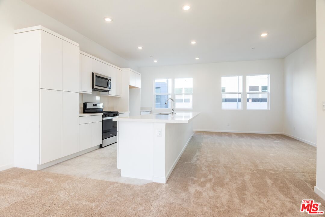 434 Hudson Street Brea, CA 92821 - Photo 14 of 44 a view of a kitchen with microwave and cabinets