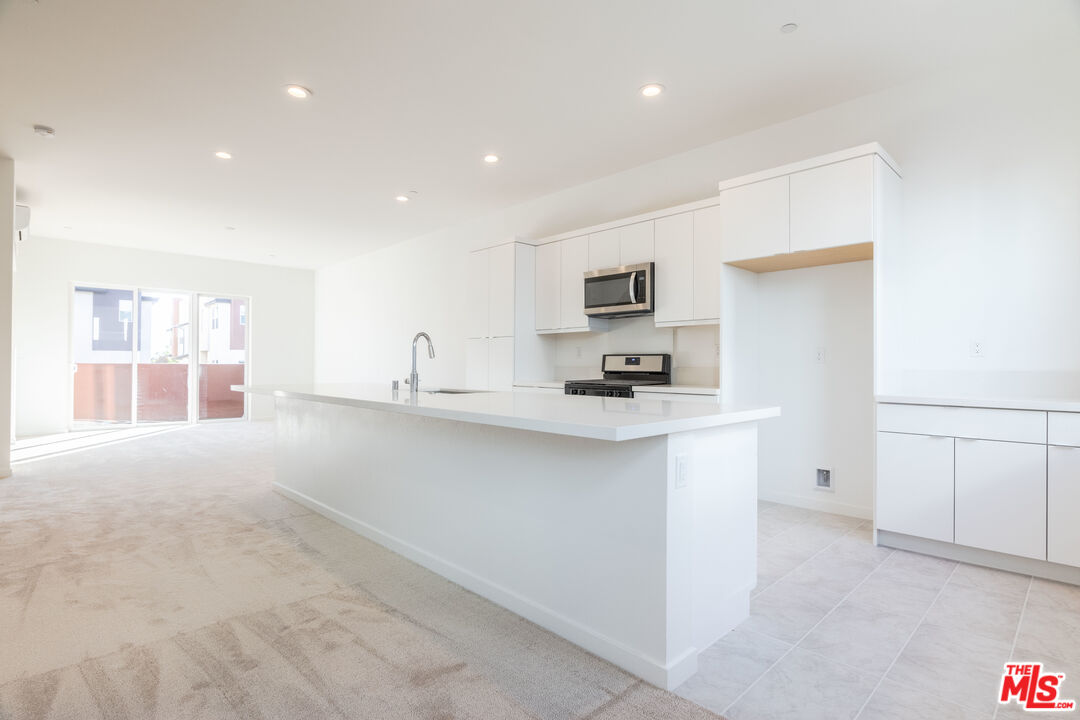 434 Hudson Street Brea, CA 92821 - Photo 19 of 44 a kitchen with cabinets and a sink