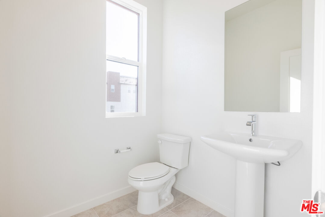 434 Hudson Street Brea, CA 92821 - Photo 27 of 44 a bathroom with a toilet sink and mirror