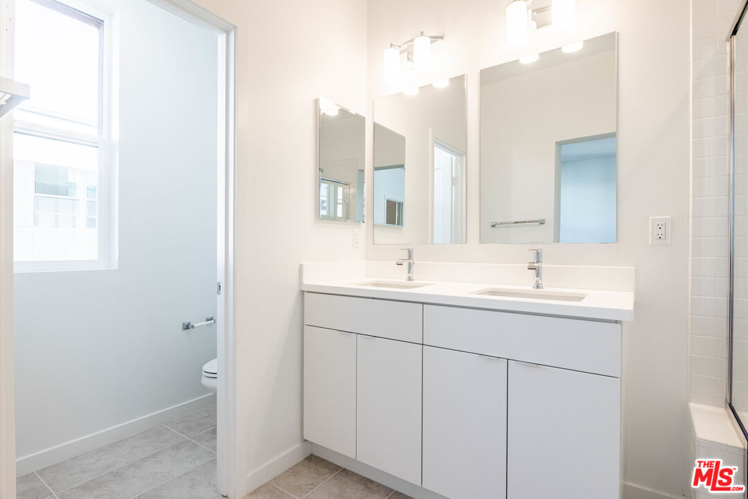 434 Hudson Street Brea, CA 92821 - Photo 40 of 44 a bathroom with a sink and a mirror