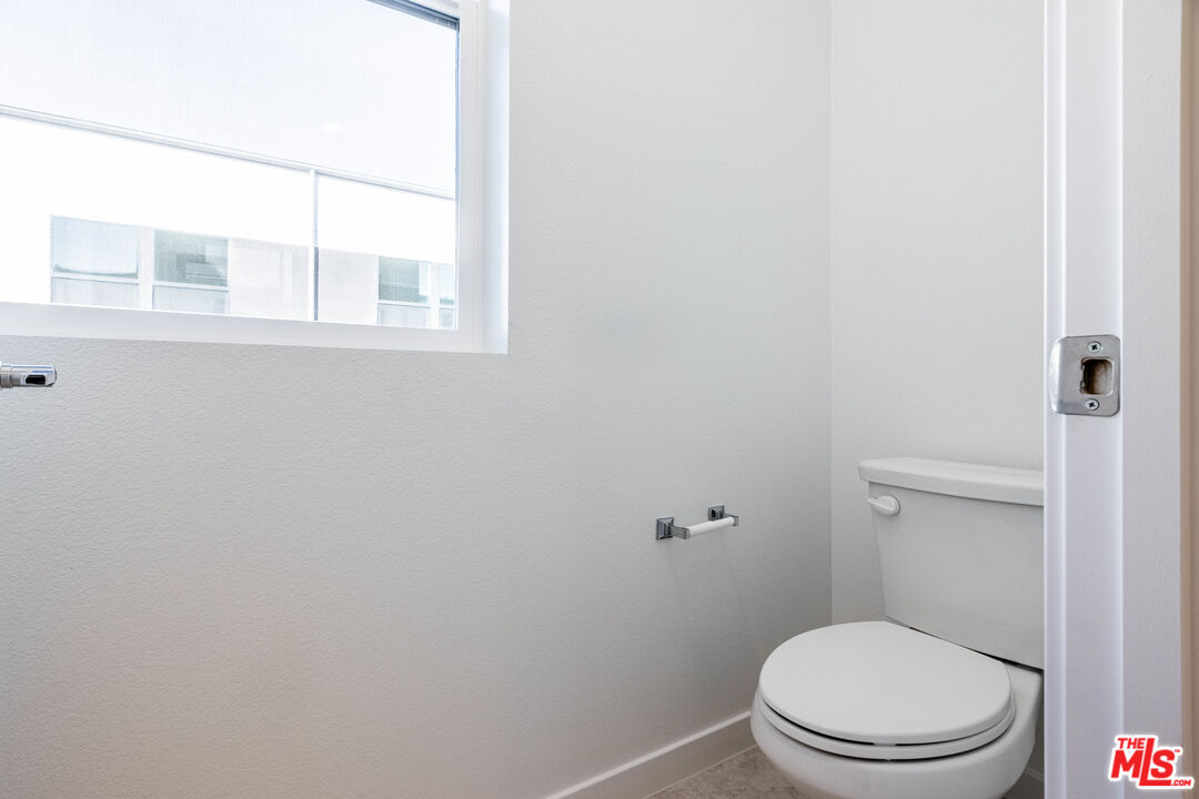 434 Hudson Street Brea, CA 92821 - Photo 42 of 44 a white toilet sitting next to a window