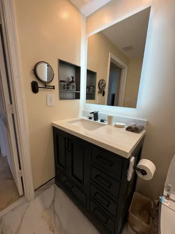 a bathroom with a sink and a mirror
