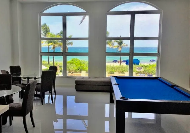 a view of a chairs and table in the patio