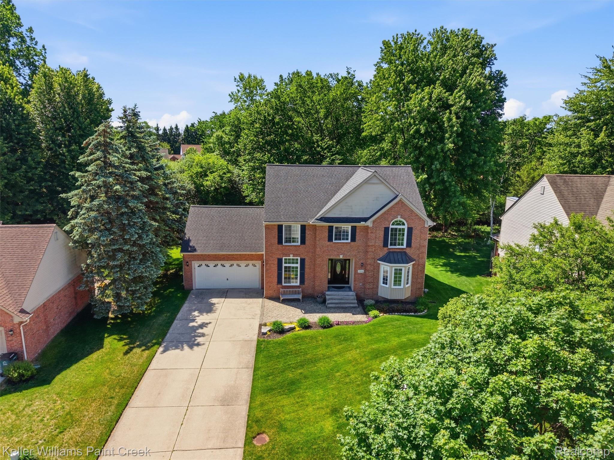2842 Manorwood Road Troy, MI 48085 - Photo 11 of 72 Brick-front two-story residence with a two-car garage and a paved driveway