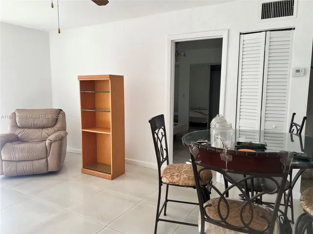 a kitchen with stainless steel appliances granite countertop a stove microwave and sink