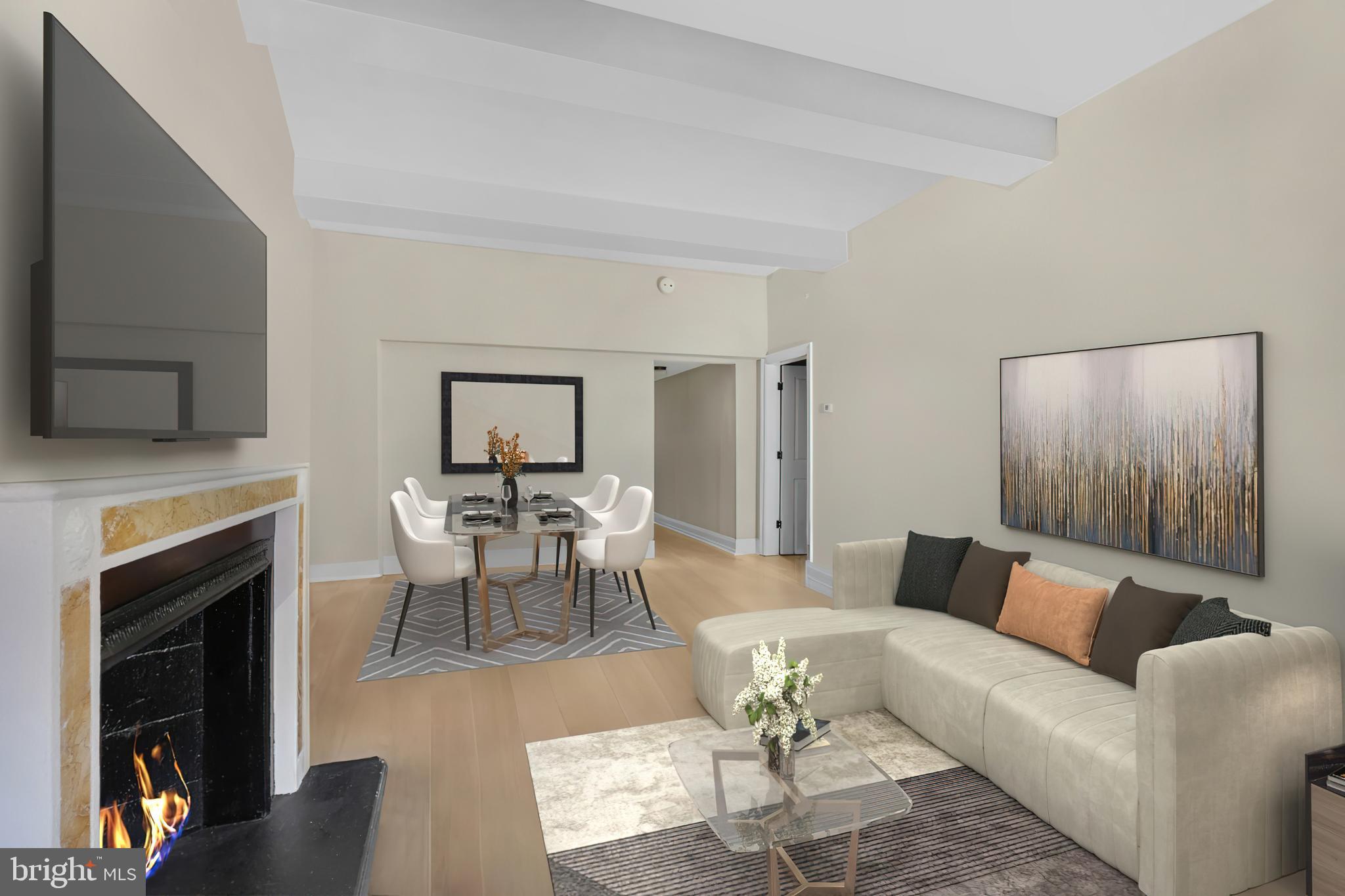 222 West Rittenhouse Square, Unit 1102 Philadelphia, PA 19103 - Photo 2 of 34 a living room with furniture and a fireplace