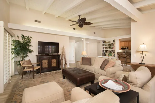 a living room with fireplace furniture and a flat screen tv