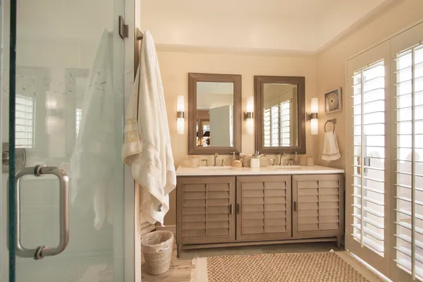 a bedroom with furniture and a potted plant