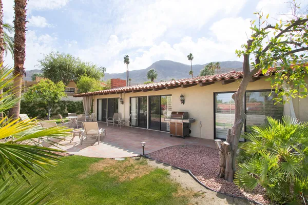 a view of a backyard with a patio