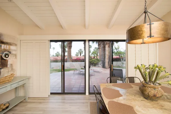 a view of a dining room with furniture window and outside view