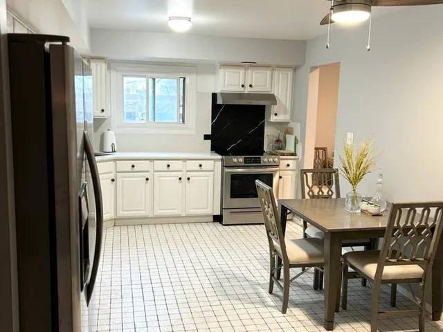a view of a livingroom with shelves