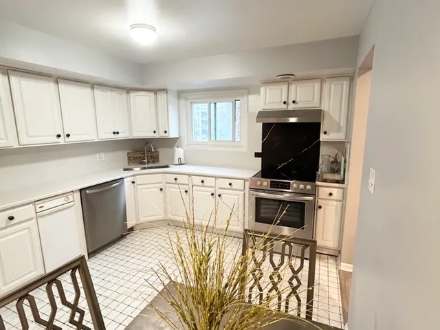 a bedroom with a bed and a table in it