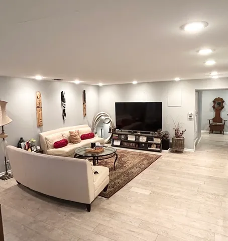 a living room with furniture and a table