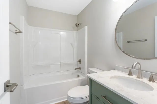 a view of storage and utility room with wooden floor