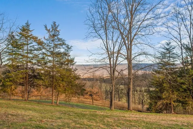 a front view of a house with a large window