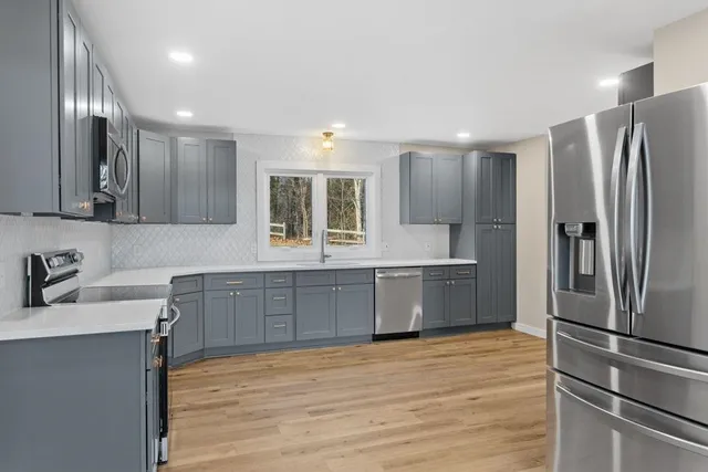 a kitchen with a sink and cabinets