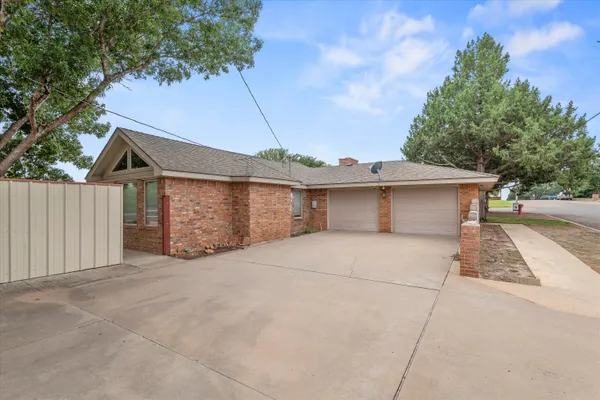 a view of garage and yard
