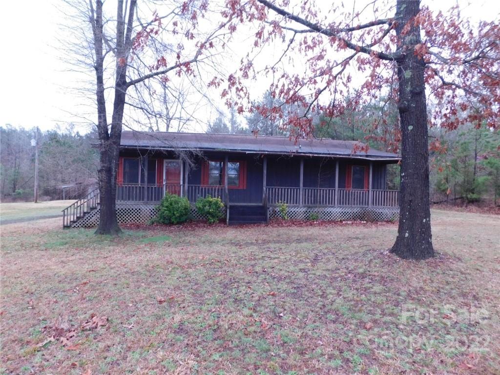 17451 White Store Road Peachland, NC 28133 - Photo 1 of 17 a front view of a house with a yard and garage