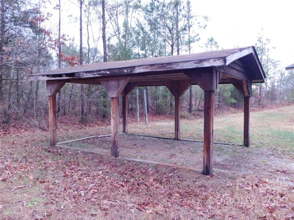 17451 White Store Road Peachland, NC 28133 - Photo 4 of 17 a view of a wooden house with a small yard