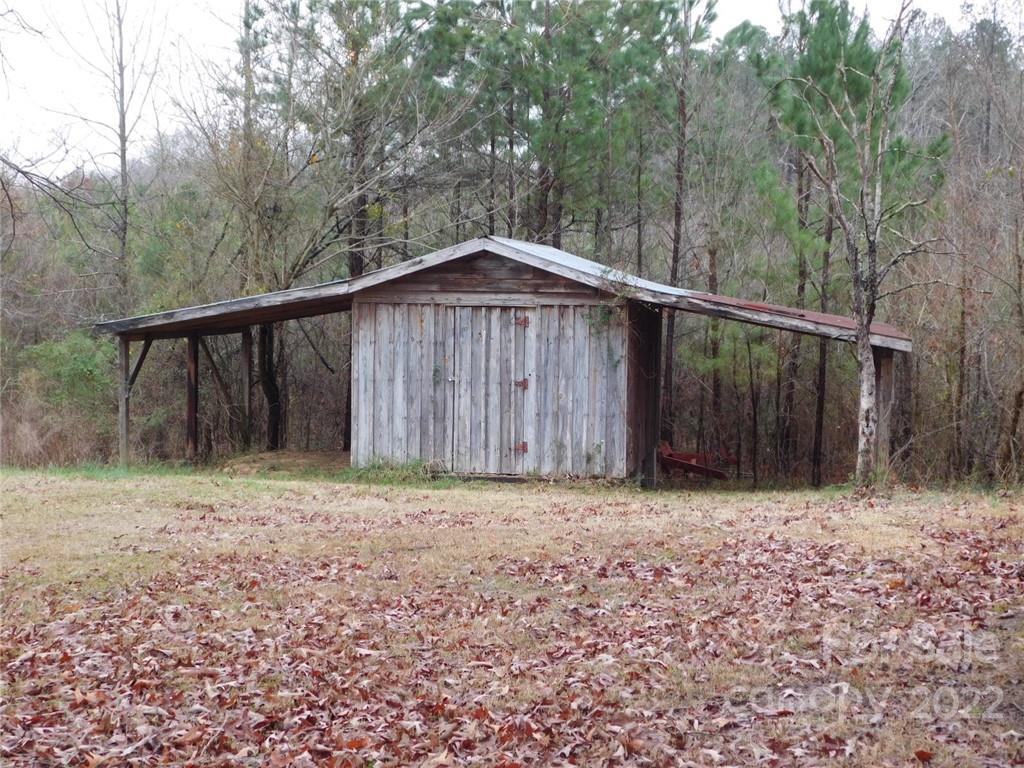 17451 White Store Road Peachland, NC 28133 - Photo 6 of 17 a backyard of a house with lots of green space