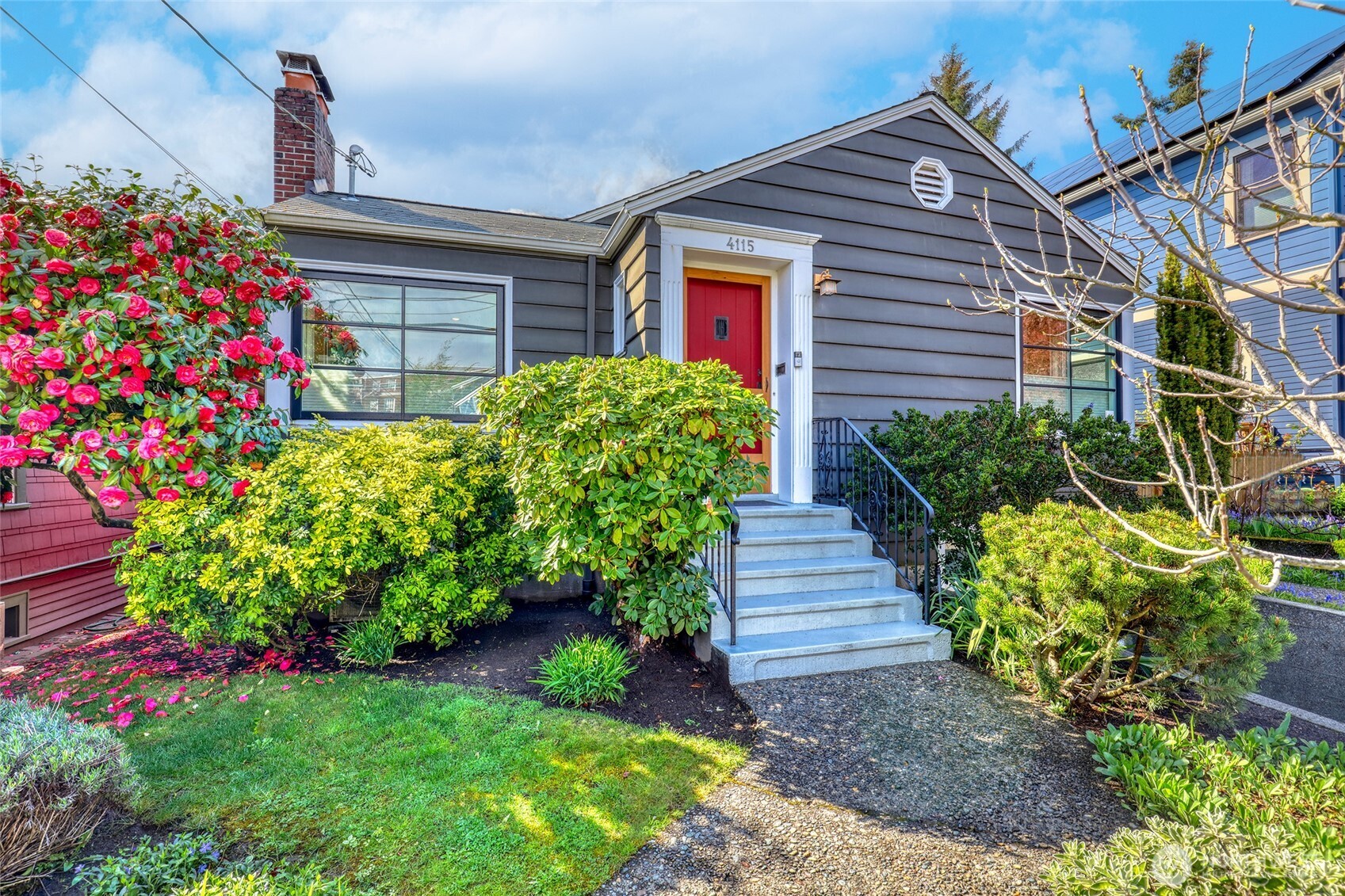 4115 Ashworth Avenue North Seattle, WA 98103 - Photo 1 of 31 a front view of a house with a yard