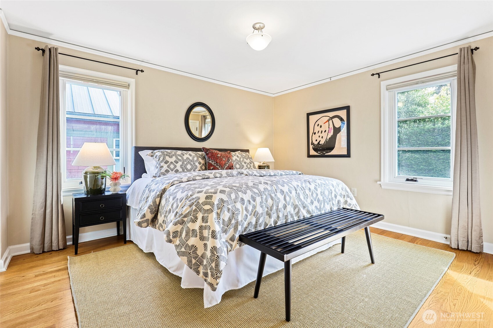 4115 Ashworth Avenue North Seattle, WA 98103 - Photo 12 of 31 a bed sitting in a bedroom next to a window