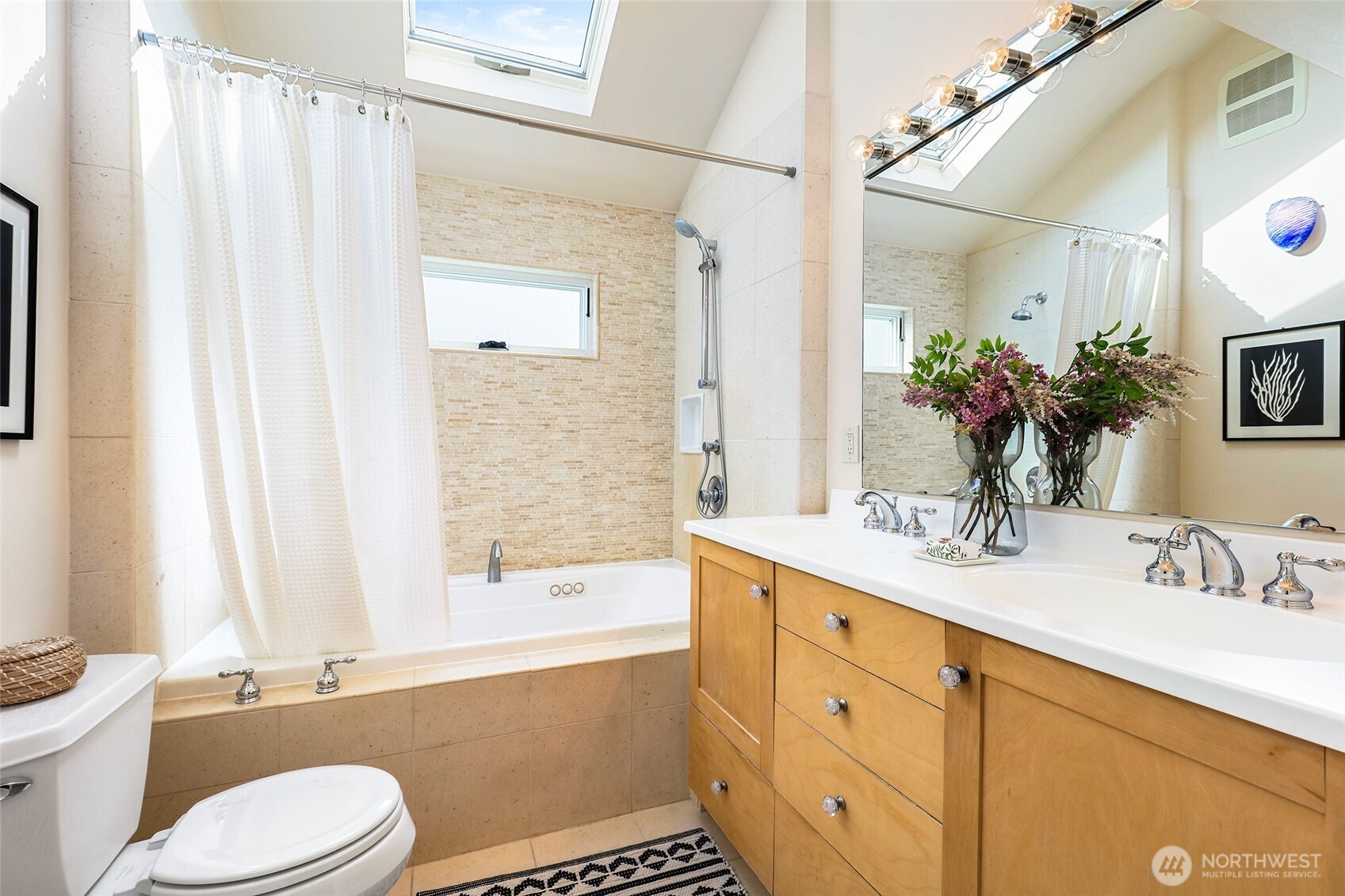 4115 Ashworth Avenue North Seattle, WA 98103 - Photo 14 of 31 a bathroom with a granite countertop sink toilet and shower