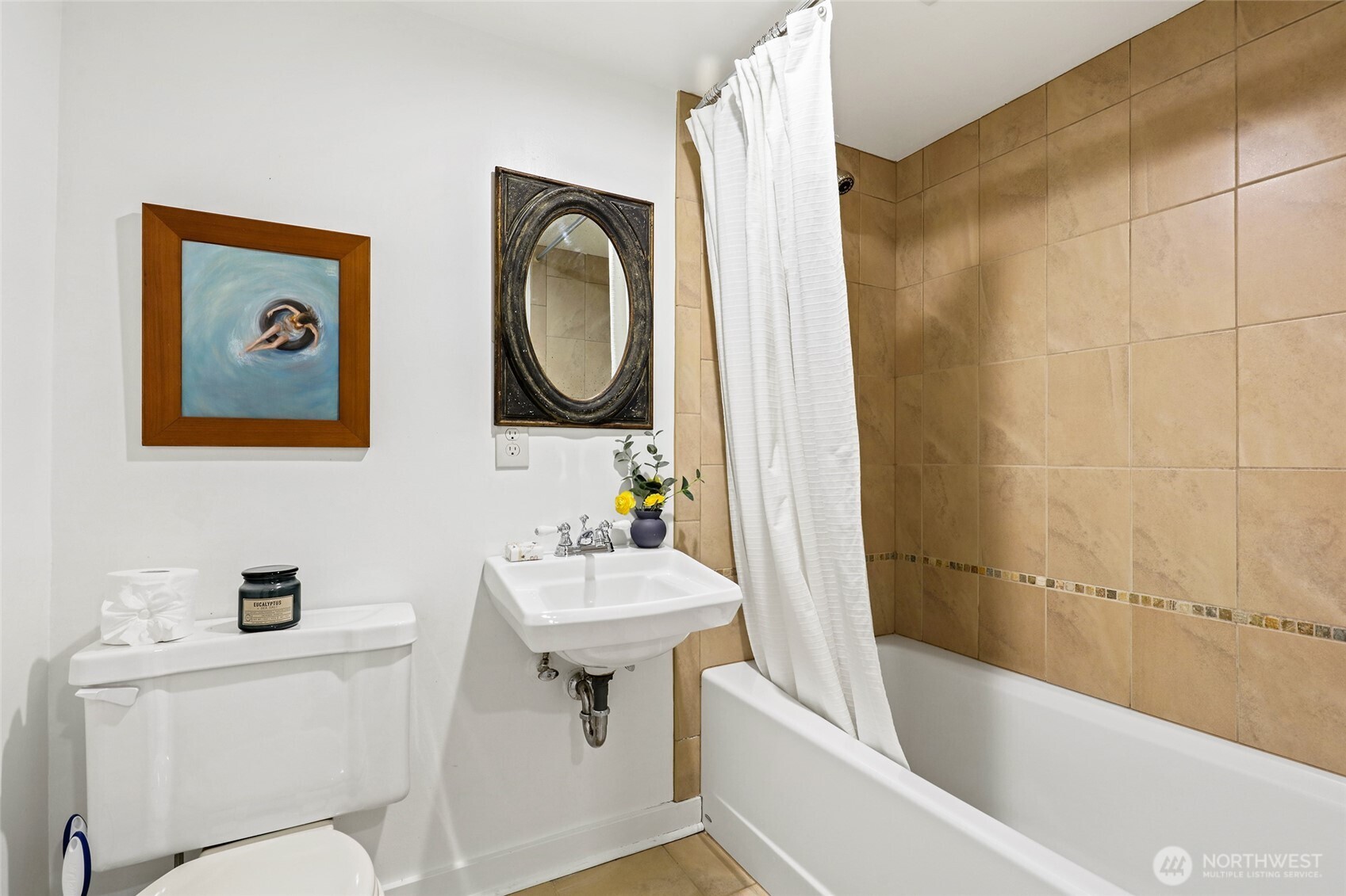 4115 Ashworth Avenue North Seattle, WA 98103 - Photo 19 of 31 a bathroom with a sink mirror bathtub and toilet