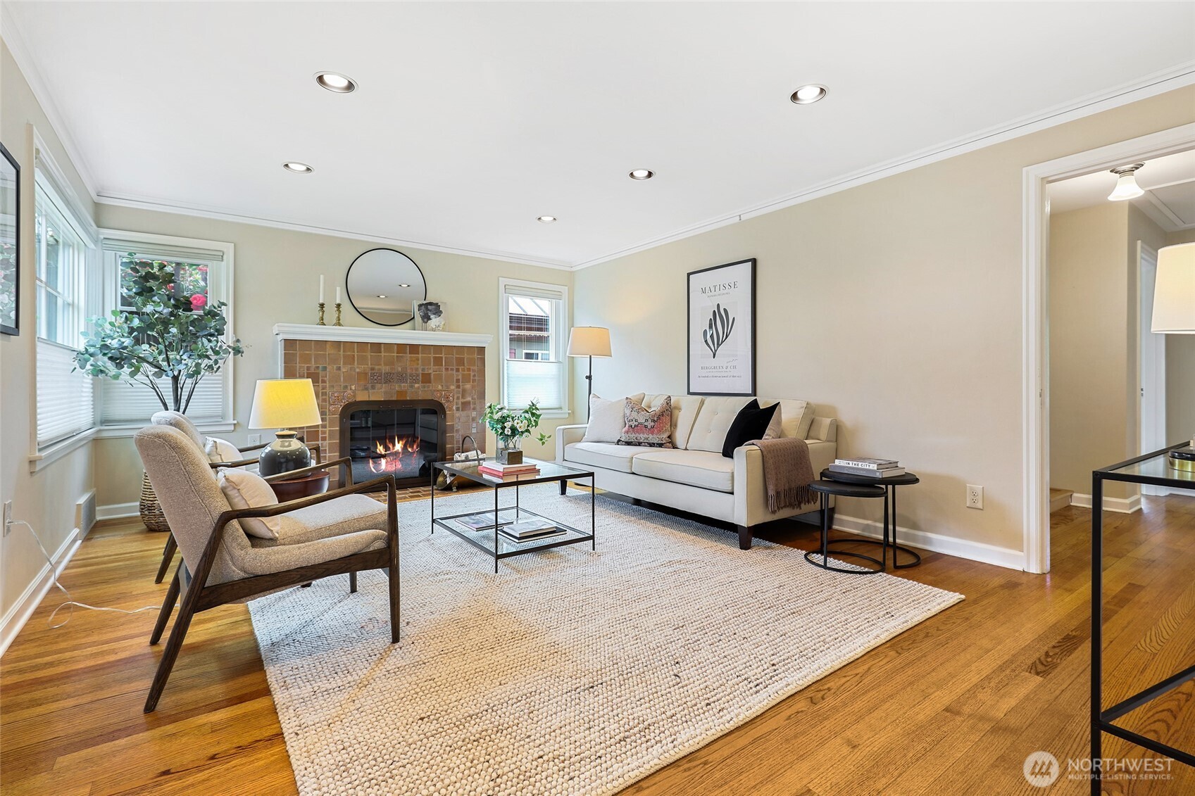 4115 Ashworth Avenue North Seattle, WA 98103 - Photo 4 of 31 a living room with furniture and a fireplace