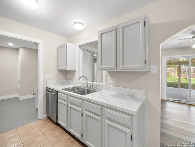 a kitchen with a sink and cabinets