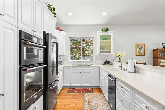 a kitchen with a sink stove and refrigerator