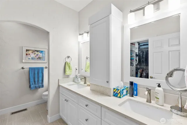 a bathroom with a granite countertop sink mirror and a