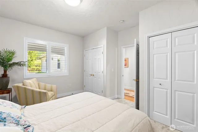 a bedroom with a bed and a couch