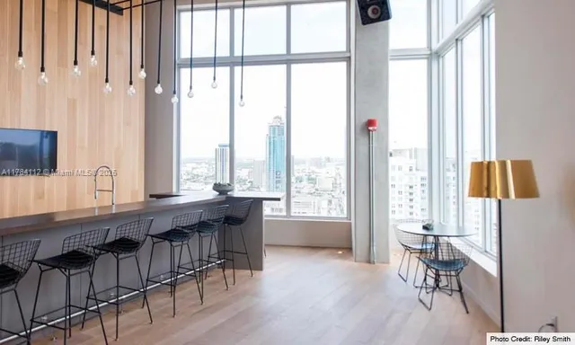 a view of a livingroom with furniture window and outside view