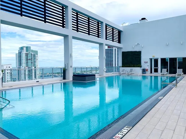 a view of swimming pool from a balcony