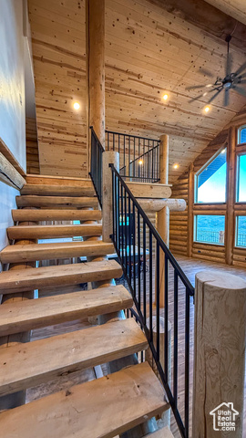 5236 North Holly Way Helper, UT 84526 - Photo 30 of 34 Stairway featuring log walls, wood ceiling, recessed lighting, a ceiling fan, and high vaulted ceiling