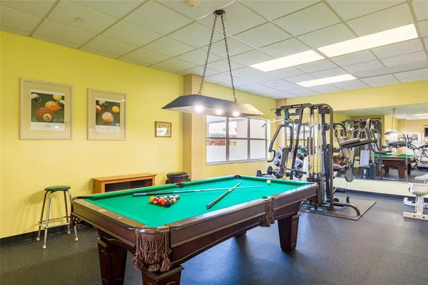 a view of a swimming pool with a lawn chairs