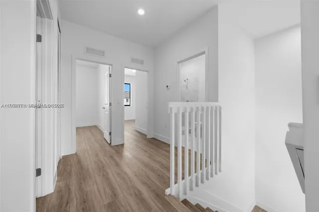 a bathroom with a shower a toilet and a sink