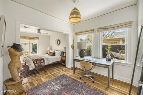 a dining room with furniture and a window