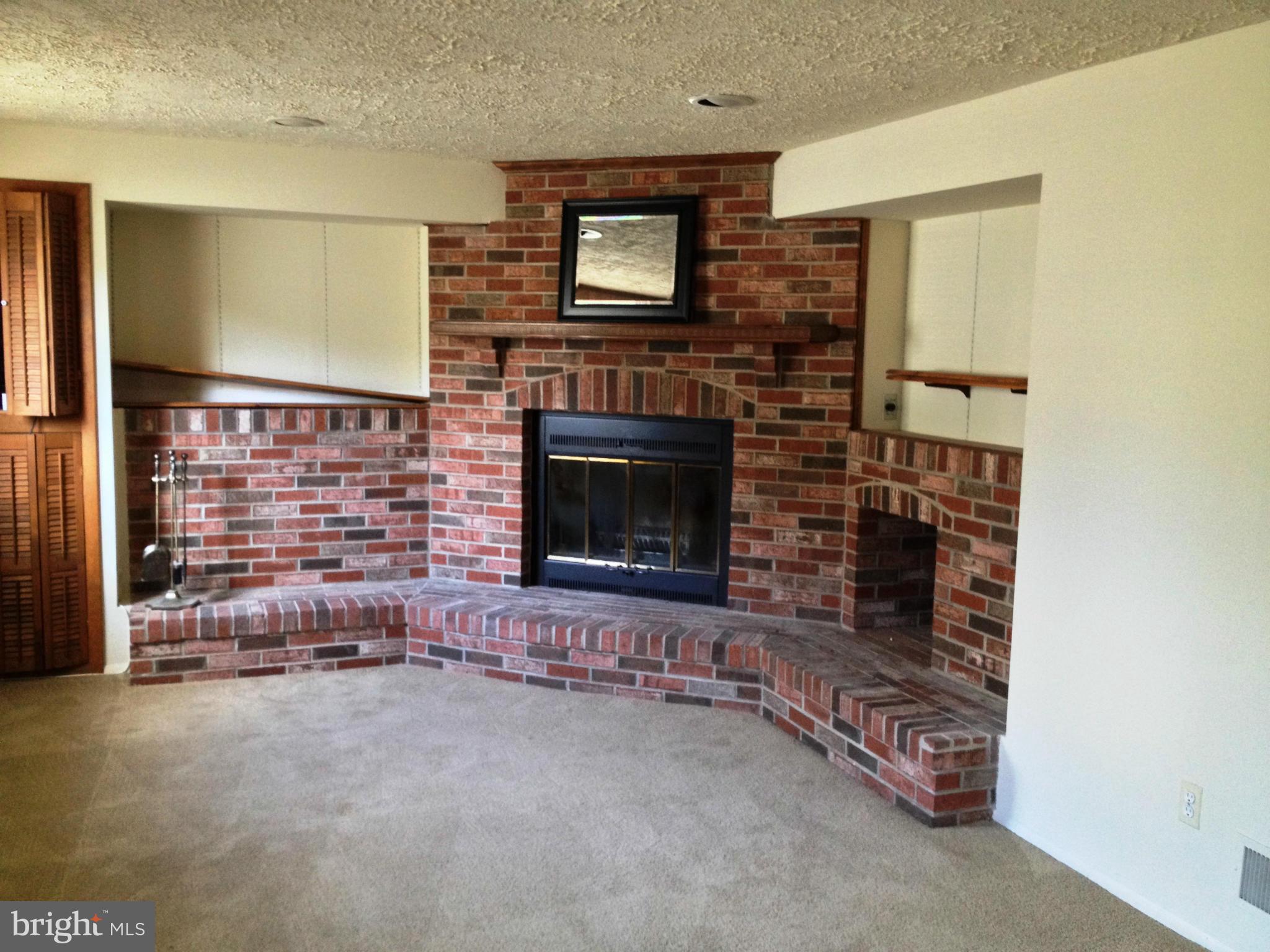 9218 Briarchip Street Laurel, MD 20708 - Photo 12 of 38 a living room with fireplace