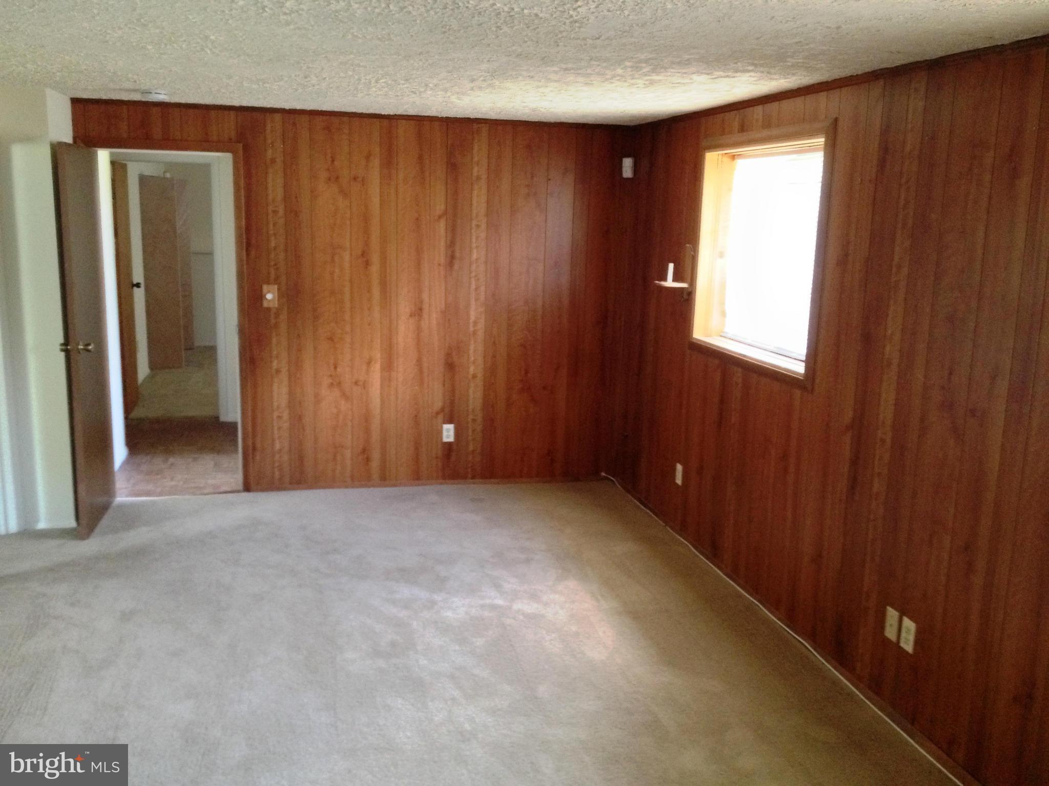 9218 Briarchip Street Laurel, MD 20708 - Photo 13 of 38 an empty room with windows