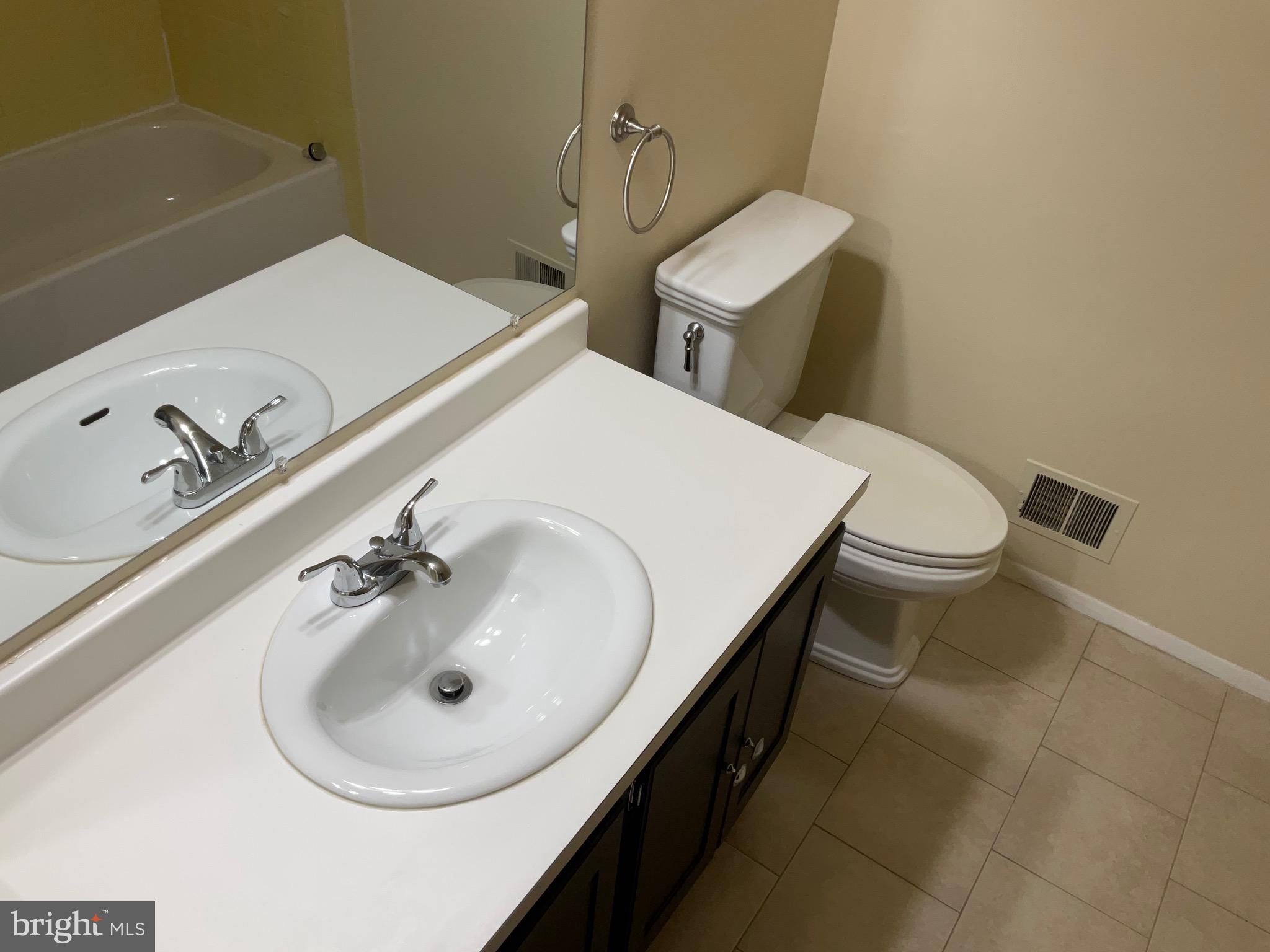 9218 Briarchip Street Laurel, MD 20708 - Photo 20 of 38 a bathroom with a sink and a toilet