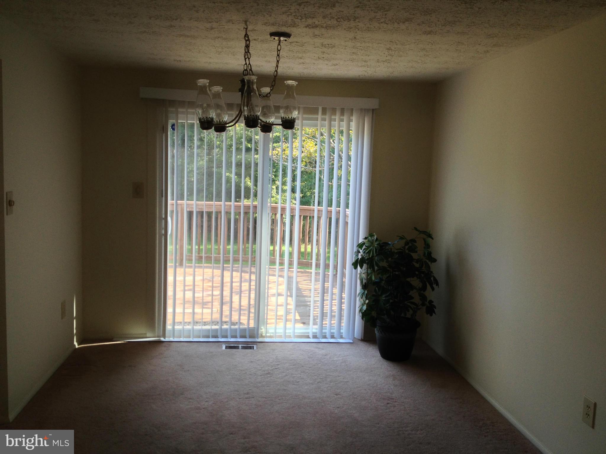 9218 Briarchip Street Laurel, MD 20708 - Photo 2 of 38 a view of an empty room with a window