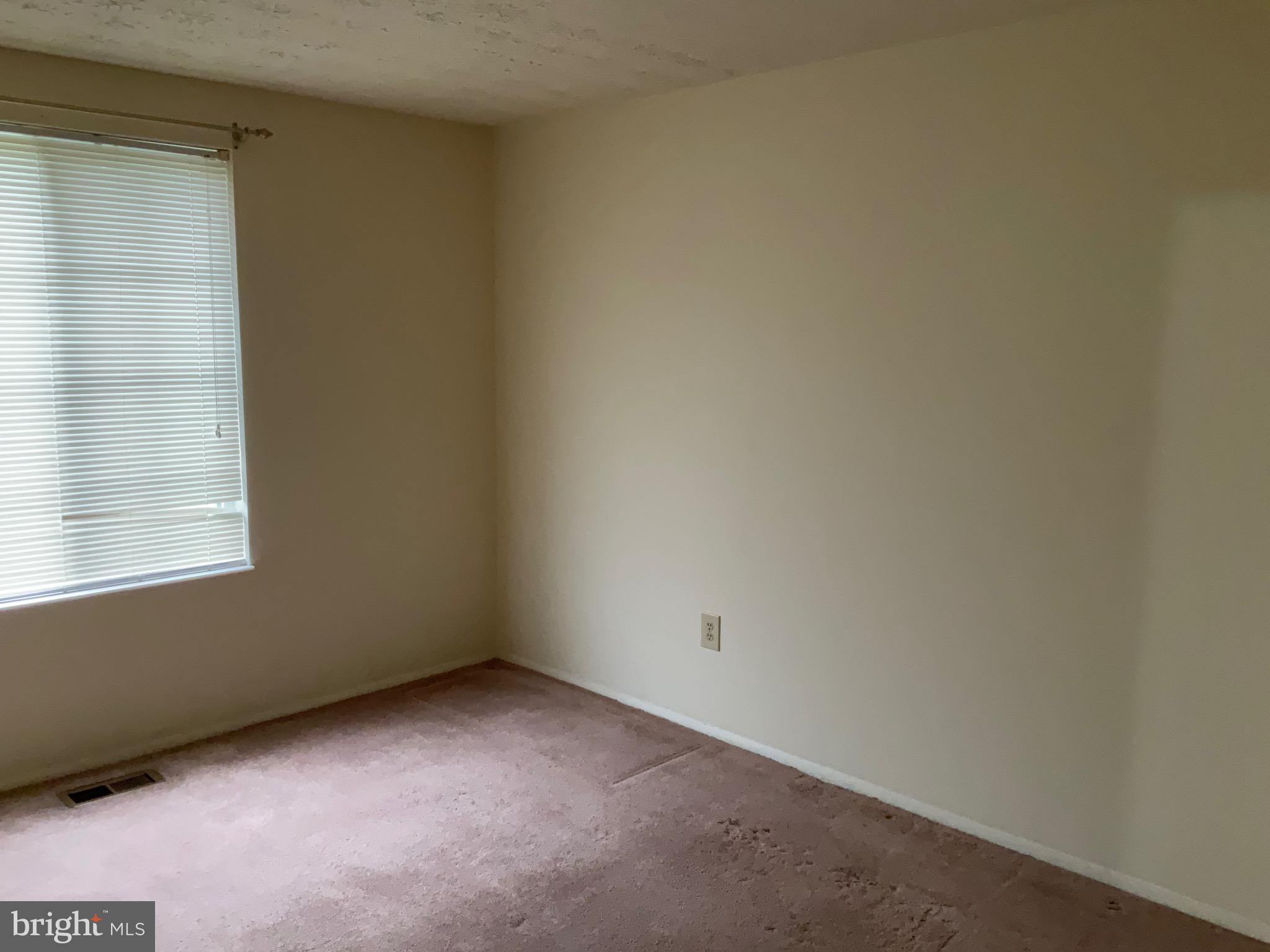 9218 Briarchip Street Laurel, MD 20708 - Photo 23 of 38 a view of an empty room with a window
